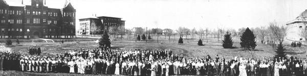 Nebraska Wesleyan campus around 1909 with a couple hundred people standing in line.
